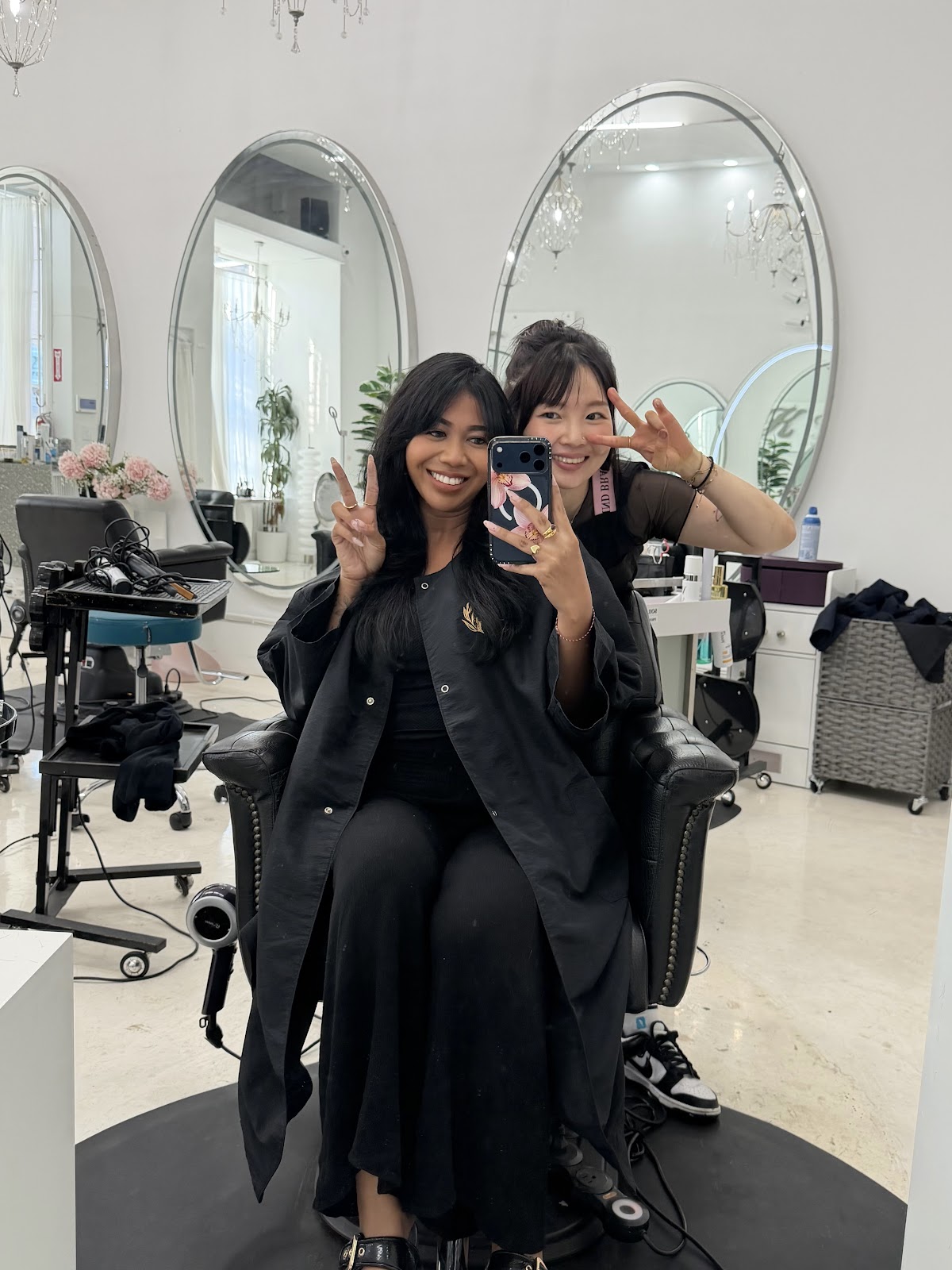 A stylist and client at the mirrors inside K Salon